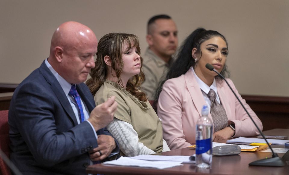 Hannah Gutierrez-Reed, center, with her attorney Jason Bowles, left, and paralegal Carmella Sisneros prepare for a sentencing hearing in state district court in Santa Fe, New Mexico (Eddie Moore/The Albuquerque Journal via AP)