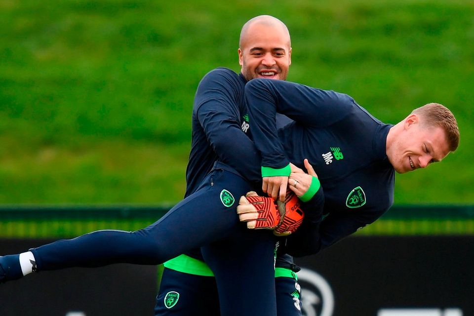 Darren Randolph gives James McClean a lift during training in Abbotstown