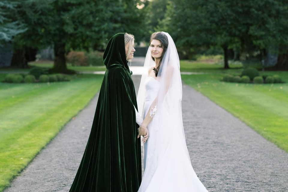 GLAMOUR: Alice Delahunt (left) with Reese Lasher during their wedding at Ashford Castle. Photos: James x Schulze