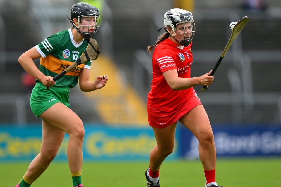 Cork's Rachel Harty races clear of Áine O'Connor of Kerry during the Munster Intermediate Camogie Final at Cusack Park in Ennis. Photo by Sportsfile