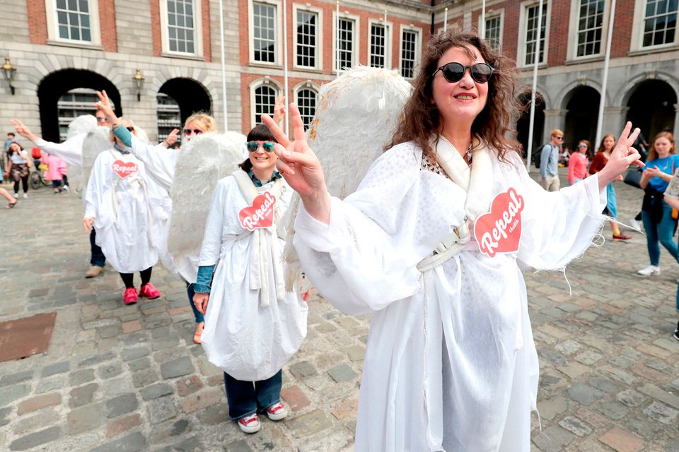 Women dressed as an angels celebrate at Dublin Castle: Niall Carson/PA Wire
