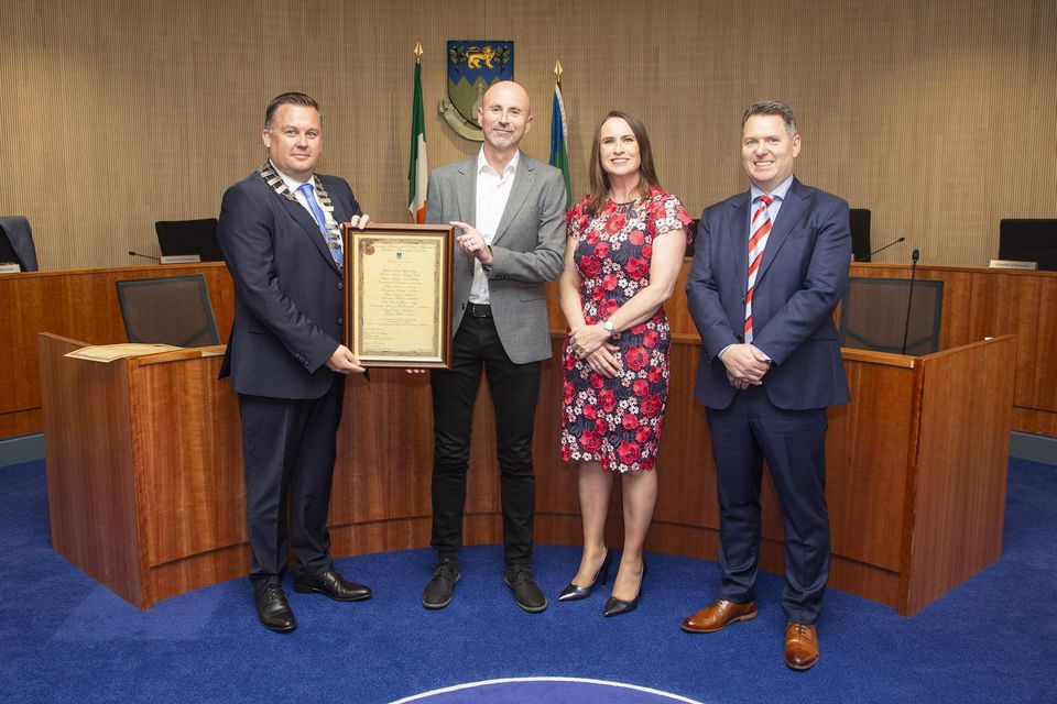 Cathaoirleach of the Wicklow Municipal District Paul O'Brien, CEO of Wicklow County Council Emer O' Gorman and Brian Gleeson present Dominic Horan with the Cathaoirleach's Achievements and Contributions to Sport Award at a Civic Reception in Council Buildings, Wicklow town.