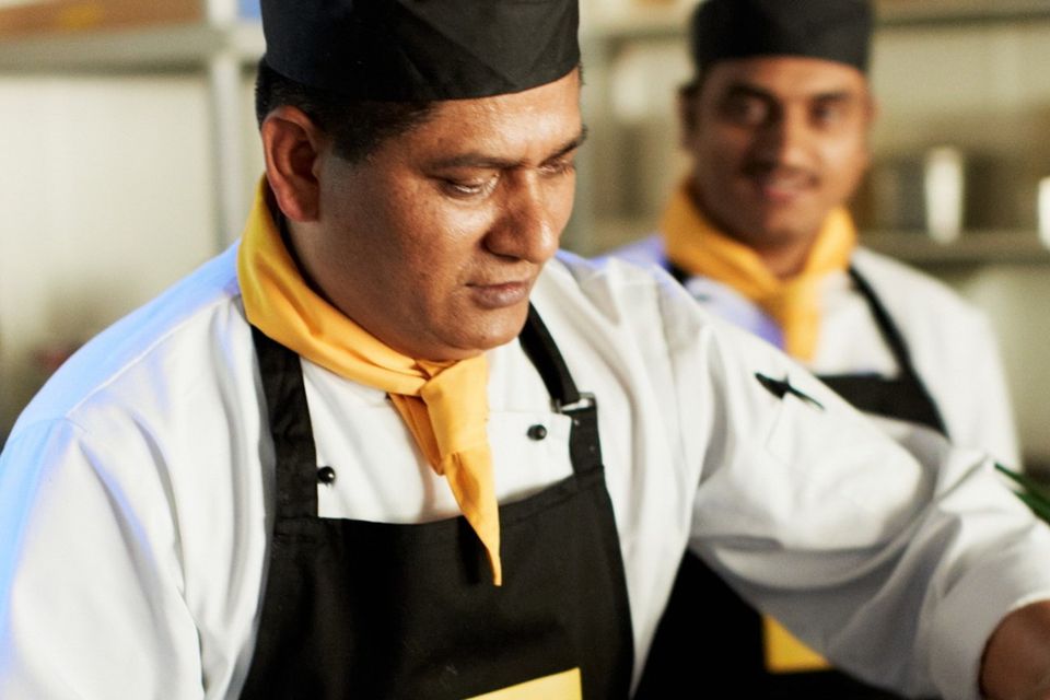 Chefs prepare naan bread at one of Bombay Pantry's restaurant outlets.
