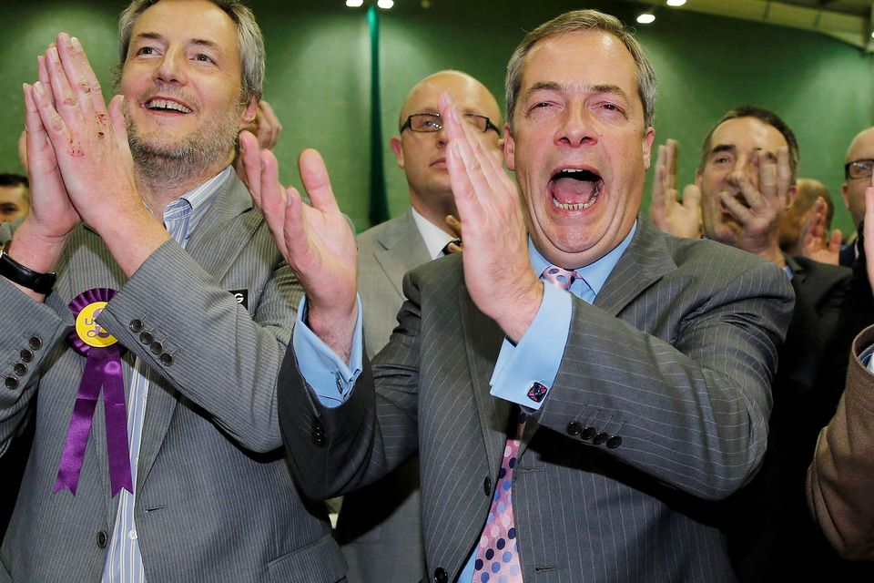 Nigel Farage, leader of the United Kingdom Independence Party (UKIP), cheers as it is announced that UKIP candidate Mark Reckless, the former Conservative Party member of Parliament for Rochester and Strood, won the by-election at Medway Park in Gillingham, southeast England, November 21, 2014 (REUTERS/Suzanne Plunkett)