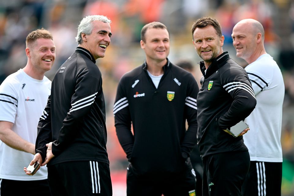 Donegal manager Jim McGuinness, second left, with his backroom team