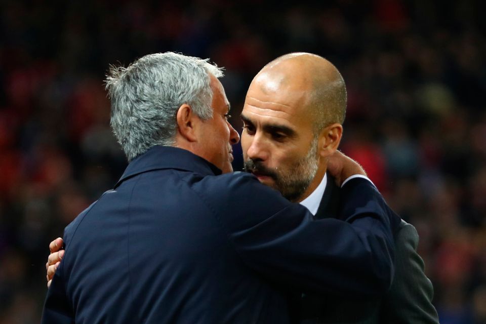 MANCHESTER, ENGLAND - OCTOBER 26:  Jose Mourinho, Manager of Manchester United (L) and Josep Guardiola, Manager of Manchester City (R) embrace prior to kick off during the EFL Cup fourth round match between Manchester United and Manchester City at Old Trafford on October 26, 2016 in Manchester, England.  (Photo by Michael Steele/Getty Images)