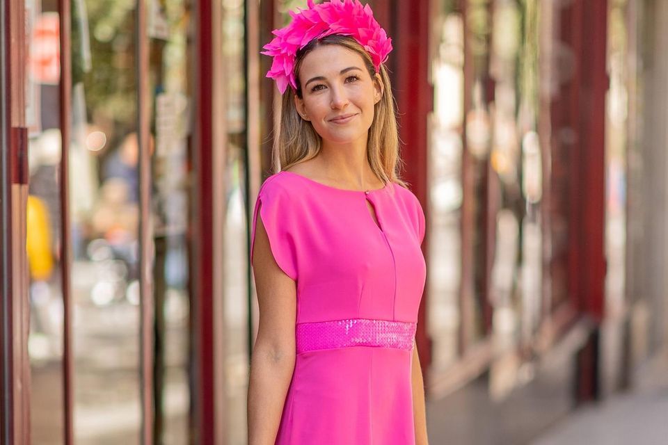 'Valeria' pink dress, accessorised with a feathered headpiece by Deb Fanning