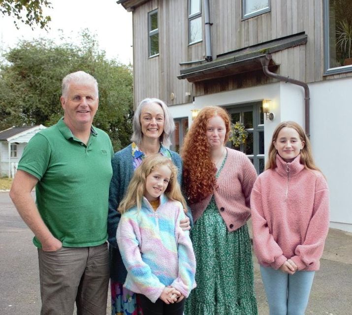 Peter and Olivia Phillips with their three girls outside their eclectic self-build in Co Louth for RTÉ's Home of the Year