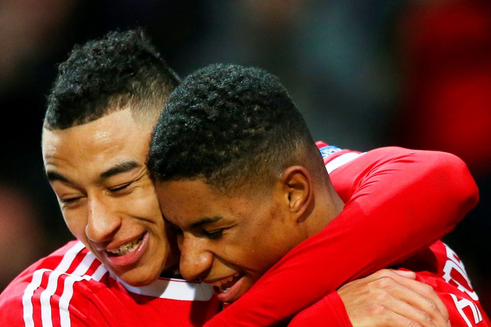 Jesse Lingard congratulates his Manchester United team-mate Marcus Rashford on his debut goal against Midtjylland in February Photo: Getty