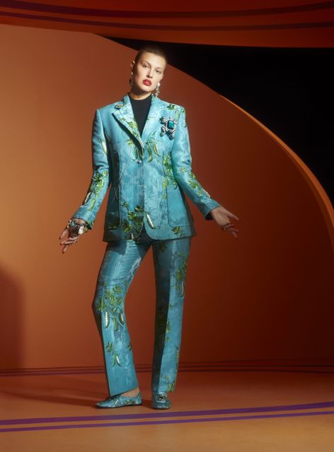 Aquamarine jacket, trousers and slipper shoes from the Iris Apfel X H&M collection