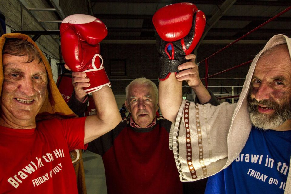Dee Jay V Sugar Rae: Boxers, Den Joe O'Connor and Danny Healy Rae, TD being announced by former Munster Boxing Council judge, David Dauber Prendiville at the Castleisland Desmonds GAA Club Brawl in the Hall press night. Photo by John Reidy