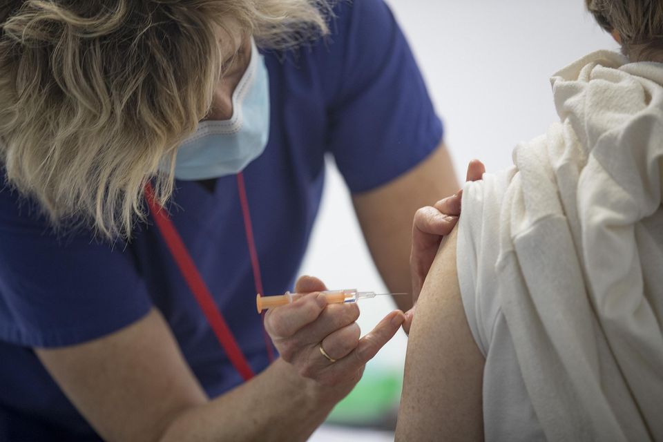A health worker administers a Covid-19 vaccine in the Aviva Stadium earlier this year. Photo: Arthur Carron