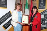 thumbnail: Mayor Michelle Hall presents the award to Ann Carolan. 