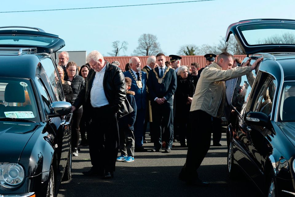 Father of Jordan and Holly Jamie Sommers, right, standing between their hearses after the funeral. Funeral of victims of Clondalkin fire. St. Anne's Church, Shankill, Dublin. Picture: Caroline Quinn