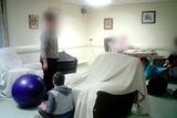 thumbnail: Ivy McGinty, a resident of Aras Attracta residential care centre, is shown being dragged around the floor by a staff member in footage shown on  RTÉ's Prime Time