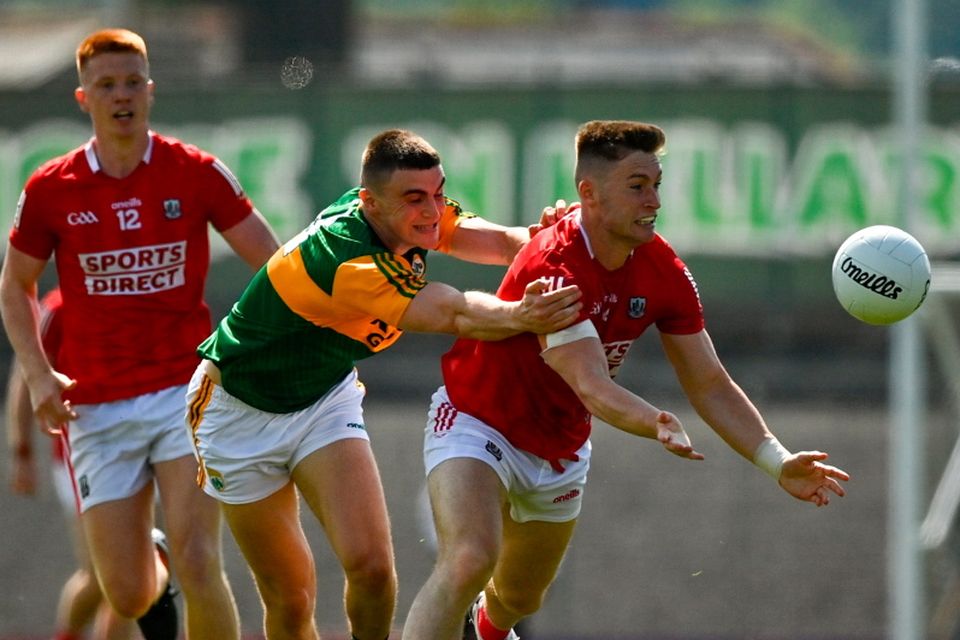 Kevin Flahive of Cork in action against Seán OShea of Kerry