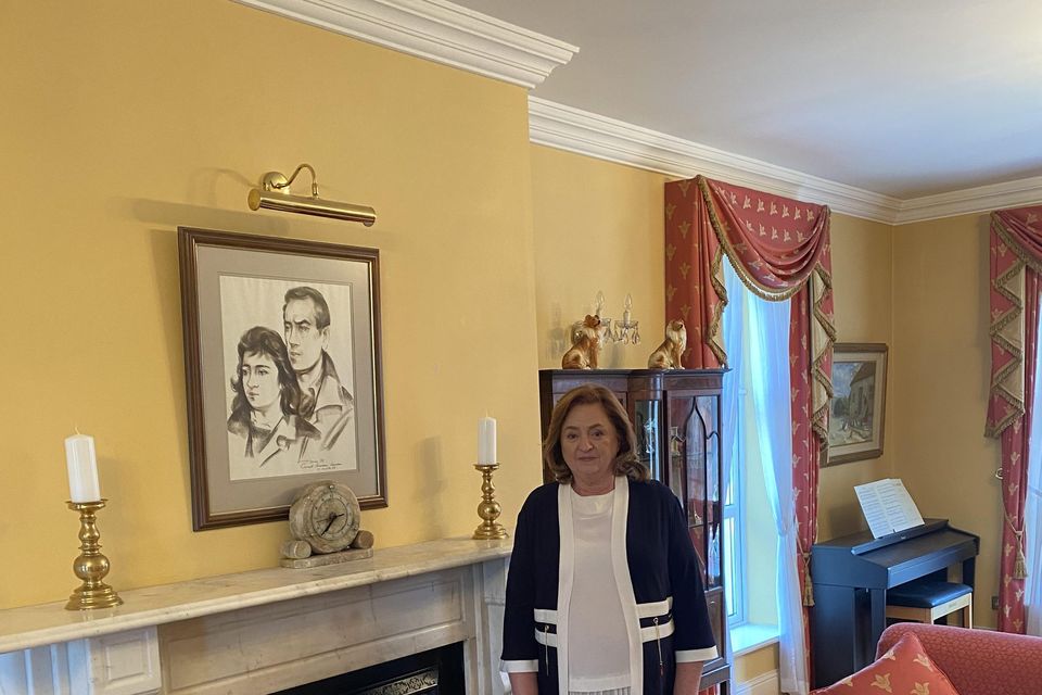 Drumure's current owner Patricia Kiernan beside a framed sketch of herself and her late husband Francis in their younger years