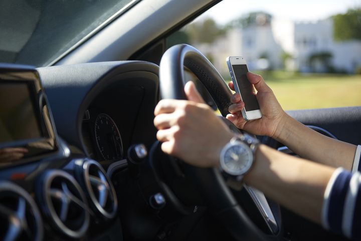 Using a phone at the wheel is both risky and unnecessary given we have hands-free options in cars