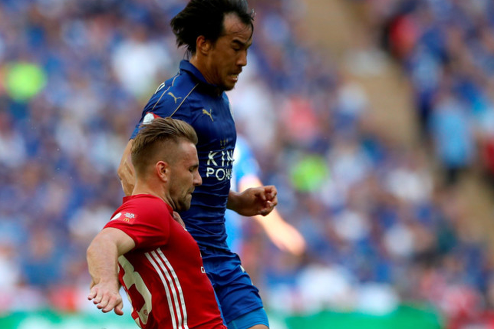 Leicester City's Shinji Okazaki (top) and Manchester United's Luke Shaw battle for the ball during the Community Shield match at Wembley. Photo: PA
