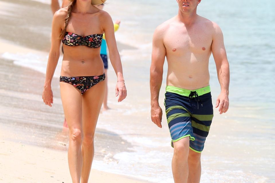 Golfer Rory McIlroy and girlfriend Erica Stoll are pictured at the beach while on holiday in Barbados. Picture: PRIMADONNA/GEMAIRA/Splash News