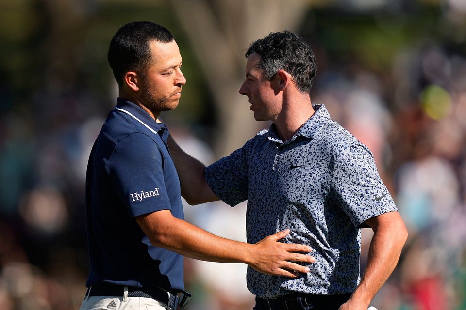 Rory McIlroy, right, is congratulated by Xander Schauffele, left, after their quarter-final round at the Dell Technologies Match Play Championship golf tournament in Austin, Texas