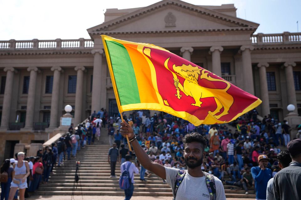 A protester outside president Gotabaya Rajapaksa's office in Colombo after the Sri Lankan president fled the country last year. Photo: AP Photo/Eranga Jayawardena
