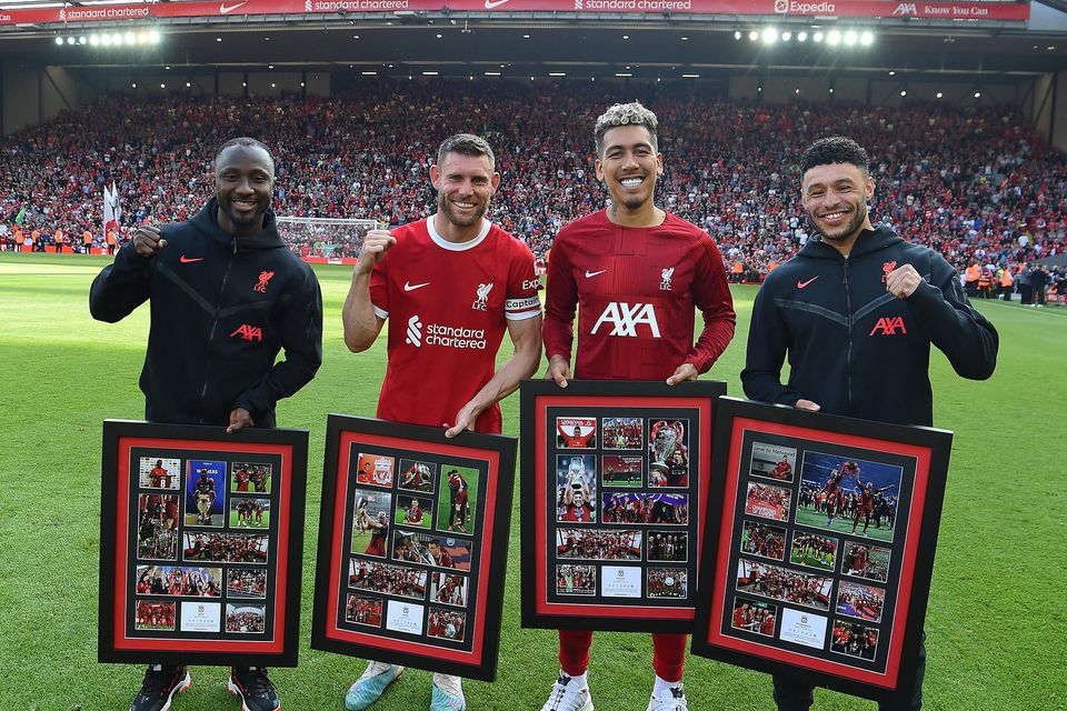 Naby Keita, James Milner, Roberto Firmino and Alex Oxlade-Chamberlain of Liverpool receive presentations at the end of the Premier League match against Aston Villa at Anfield. Photo by John Powell/Liverpool FC via Getty Images