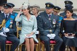 thumbnail: (L-R front row) Britain's Prince William, Duke of Cambridge, Britain's Catherine, Duchess of Cambridge, Britain's Prince Harry, Duke of Sussex, and Britain's Meghan, Duchess of Sussex attend a ceremony to present a new Queen's Colour to the Royal Air Force (RAF) at Buckingham Palace in London on July 10, 2018 to mark its centenary