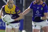 thumbnail: Wexford's Kevin O'Grady has Wicklow's Dean Healy for company.