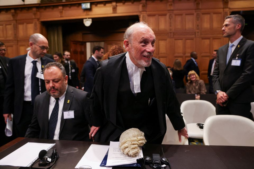 Legal adviser to Israel's Foreign Ministry Tal Becker sits next to British jurist Malcolm Shaw inside the International Court of Justice (ICJ) as judges hear a request for emergency measures by South Africa to order Israel to stop its military actions in Gaza, in The Hague, Netherlands, on Friday. Photo: Reuters