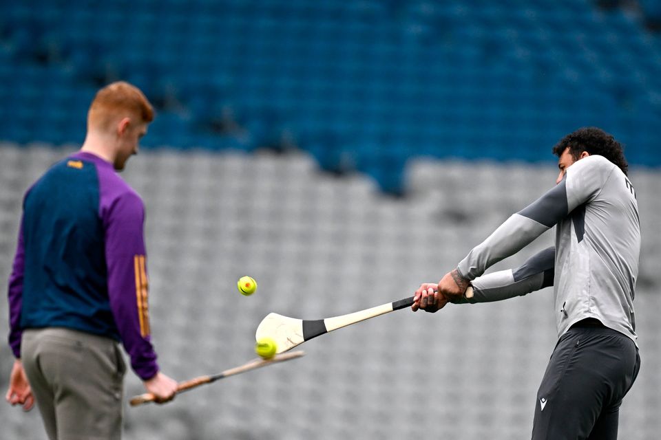 Courtney Lawes plays hurling during a Northampton Saints captain's run at Croke Park in Dublin. Photo: Harry Murphy/Sportsfile