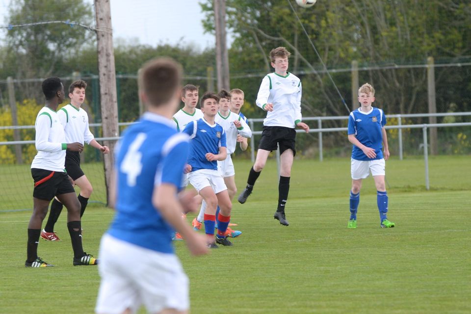 19/05/15.Eoin Massey gets the ball away during the Under 15s soccer final between Colaiste Phadraig CBS and Templeouge College at Peamount Utd.
Pic: Justin Farrelly.