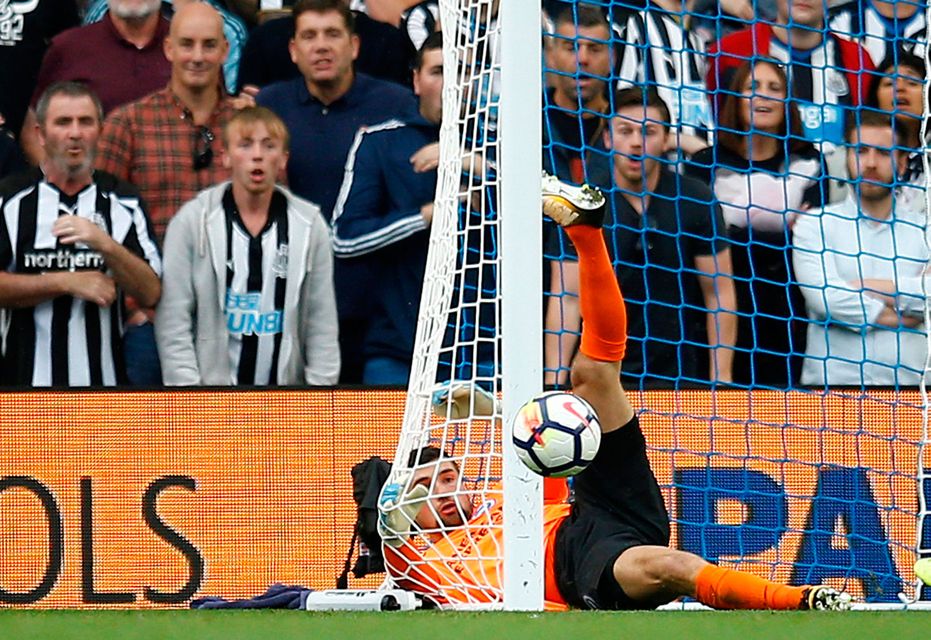 Brighton goalkeeper Mathew Ryan makes a smart save to deny Jonjo Shelvey. Photo: REUTERS/Peter Nicholls