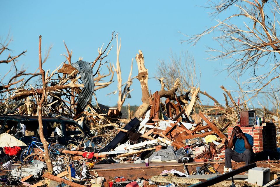 A man talks on the phone among the wreckage in Rolling Fork, Mississippi after the series of powerful storms and at least one tornado. Photo: Will Newton/Getty