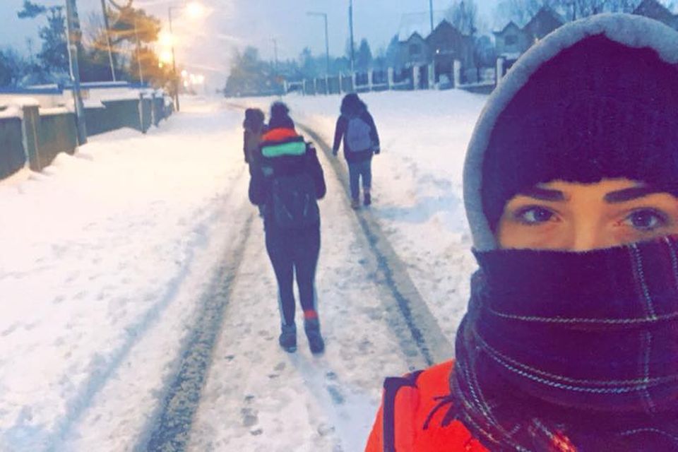 Aoife Butler walking to work with her three colleagues during Storm Emma