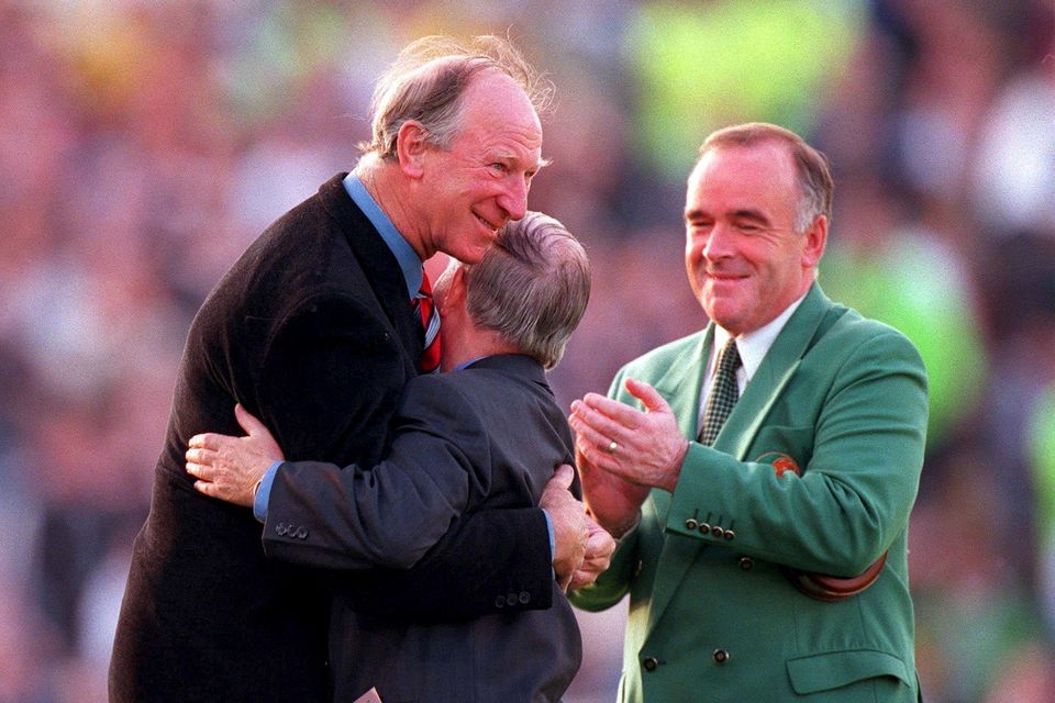 30 May 2000; Republic of Ireland equipment officer Charlie O'Leary, centre, is embraced by former Republic of Ireland manager Jack Charlton, left, after he was presented with a momento for his services to Irish soccer, as Pat Quigley, President of the Football Association of Ireland, watches on during the International Friendly match between Republic of Ireland and Scotland at Lansdowne Road in Dublin. Photo by David Maher/Sportsfile
