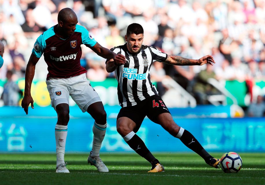 Newcastle United's Aleksandar Mitrovic in action with West Ham United's Angelo Ogbonna Photo: REUTERS/Scott Heppell