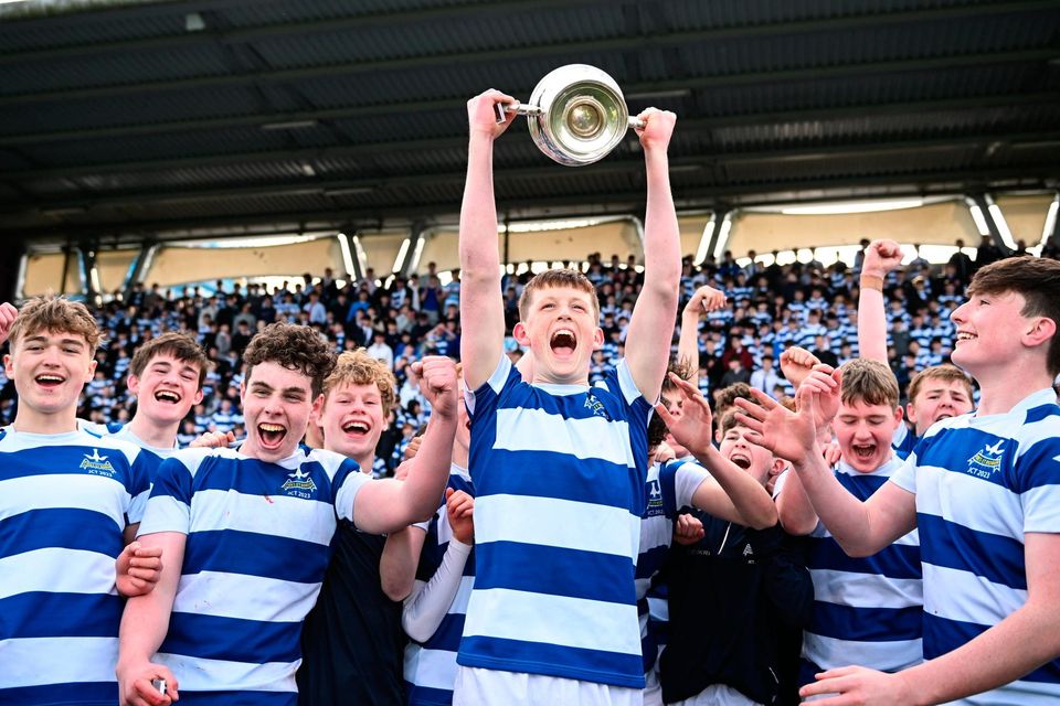 Blackrock College's Luke Coffey lifts the trophy after his side's Leinster Schools Junior Cup final victory. Photo: Harry Murphy/Sportsfile
