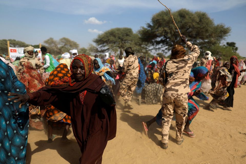 Soldiers attack refugee women in a row over food parcels in Chad near  the border with Sudan. Photo: Zohra Bensemra/Reuters
