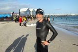 thumbnail: Ironman Aichlinn O'Reilly after he finished in Busselton, south of Perth, in Australia