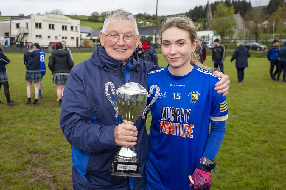 Tommy Murphy with his granddaughter Ana Dragusin after Coláiste Bhríde's win in the Wicklow Schools Senior 'A' football final in Annacurra. 