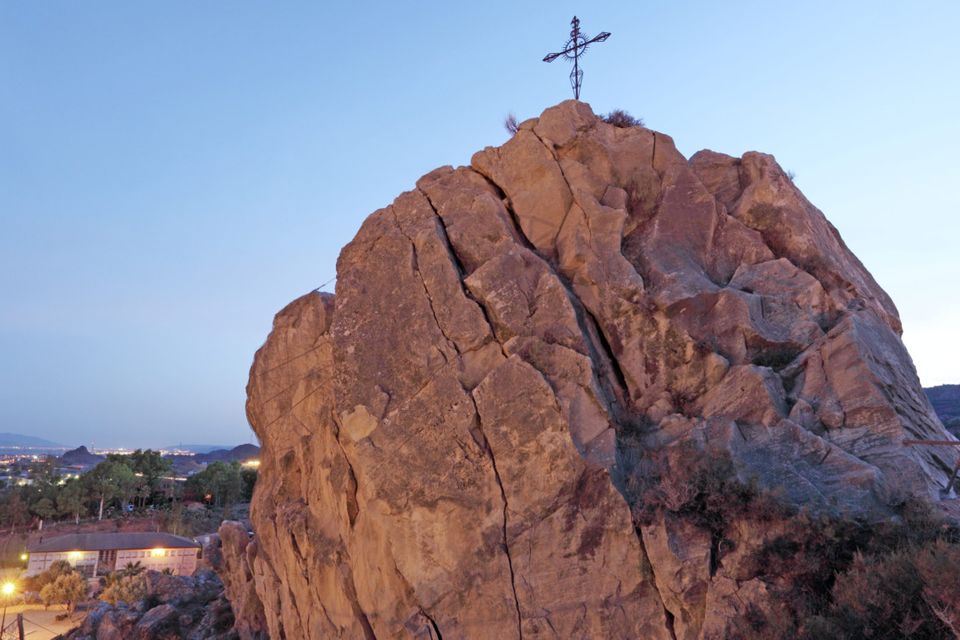 A Christian cross on a rock above the town of Lorca in the province of Murcia, Spain