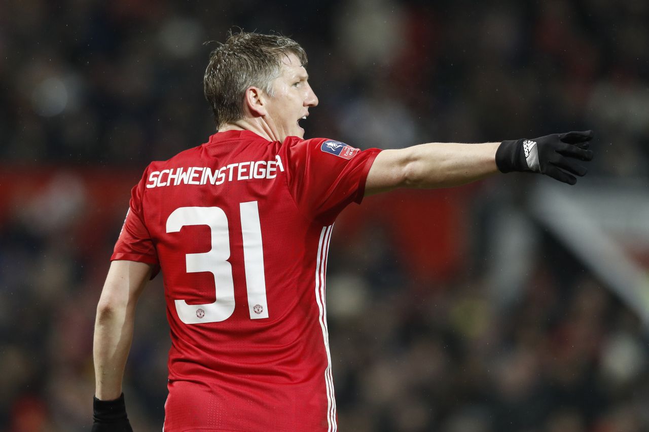 Former Manchester United star Bastian Schweinsteiger throws first