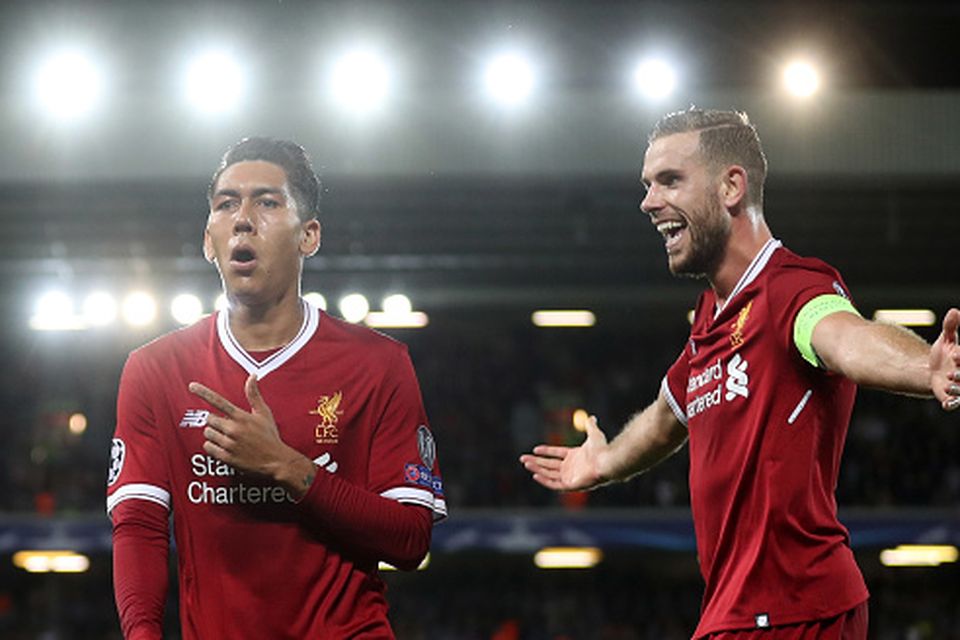 LIVERPOOL, ENGLAND - AUGUST 23:  Roberto Firmino of Liverpool celebrates scoring his sides fourth goal with Jordan Henderson of Liverpool during the UEFA Champions League Qualifying Play-Offs round second leg match between Liverpool FC and 1899 Hoffenheim at Anfield on August 23, 2017 in Liverpool, United Kingdom.  (Photo by Mark Robinson/Getty Images)