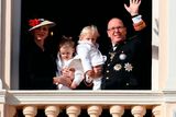 thumbnail: Prince Albert II of Monaco (R) holding Prince Jacques, and princess Charlene of Monaco (L) holding Princess Gabriella, appear on the balcony of the Monaco Palace during the celebrations marking Monaco's National Day