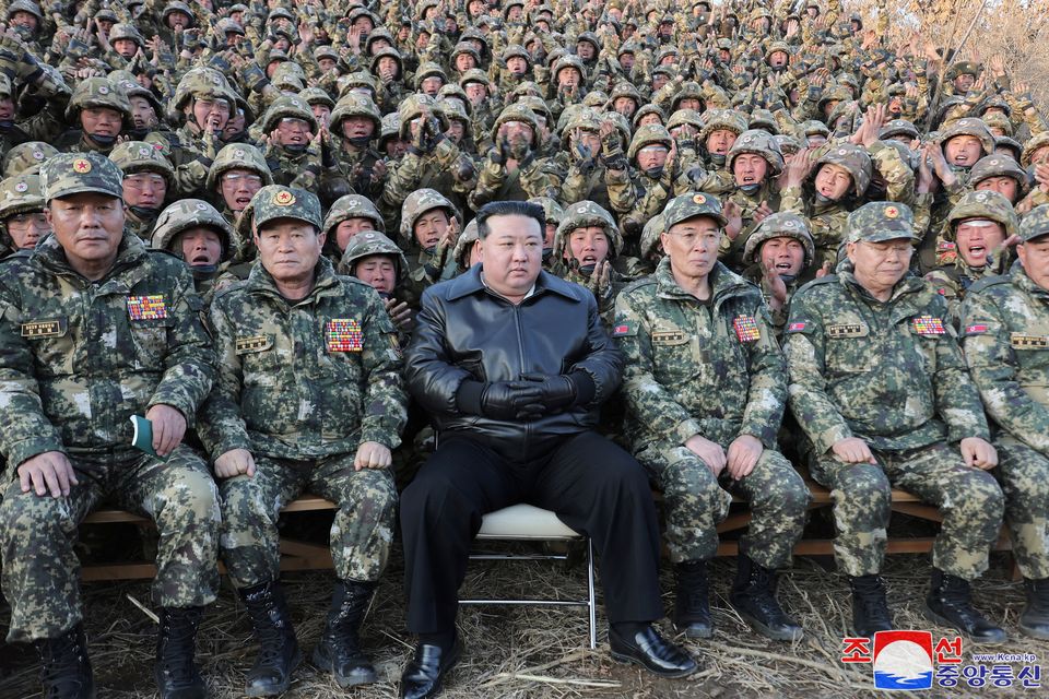 North Korean leader Kim Jong Un with troops in the western region of the country, where he reportedly ordered heightened readiness for war. Photo: Reuters