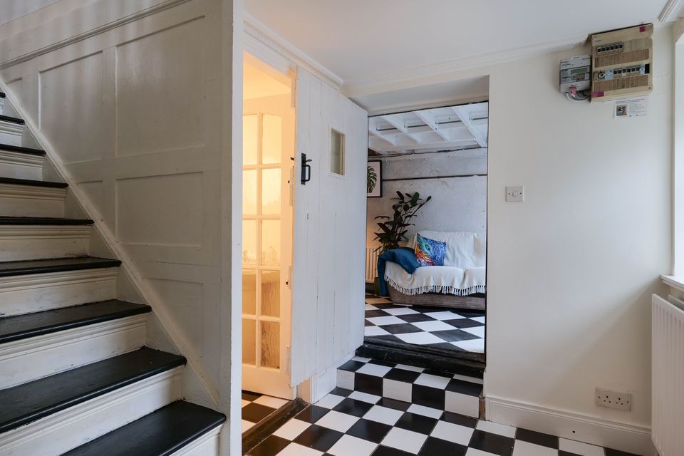 Black and white tiles in the converted shed