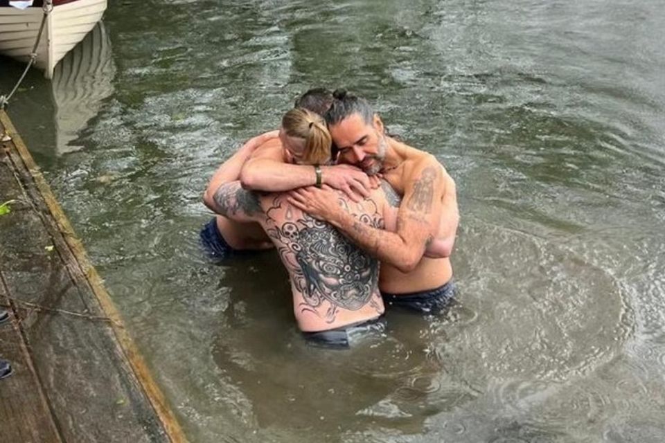 Bear Grylls helps to baptise Russell Brand. Photo: Instagram