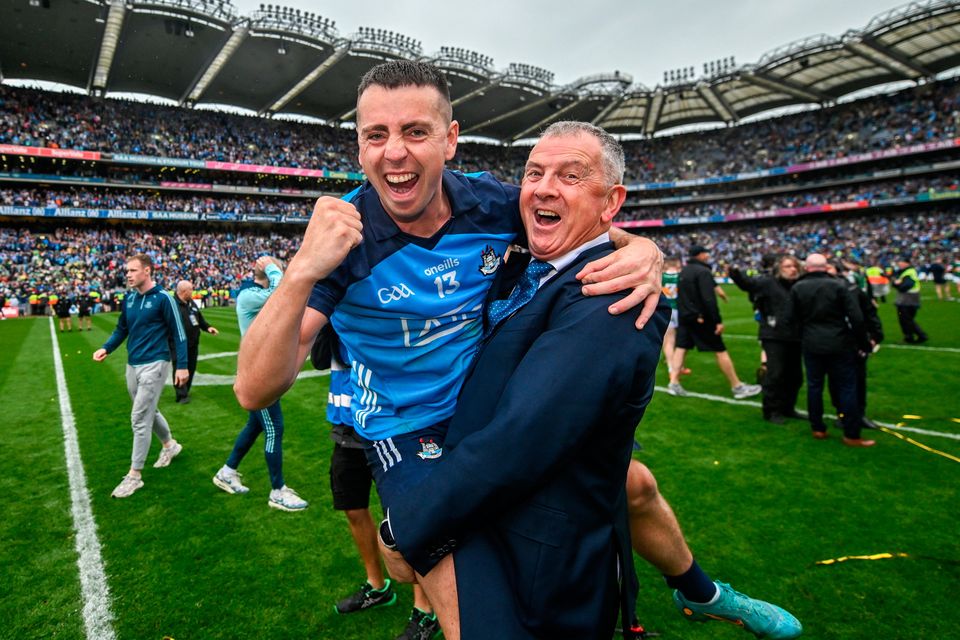 Retiring Dublin GAA chief executive John Costello celebrates with his son Cormac after this season's All-Ireland final. Photo: Sportsfile