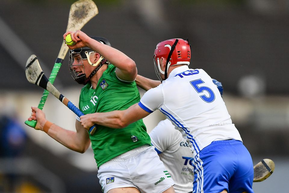 Gearóid Hegarty of Limerick is tackled by Jack Fagan of Waterford. Photo: Ray McManus/Sportsfile
